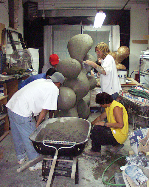 Installationss 03 Splats 06 – Assistants cementing “Sue’s Splat”, Ferro-concrete/enamel paint.  5’ x4 ½’ x 2 ½’.  2006